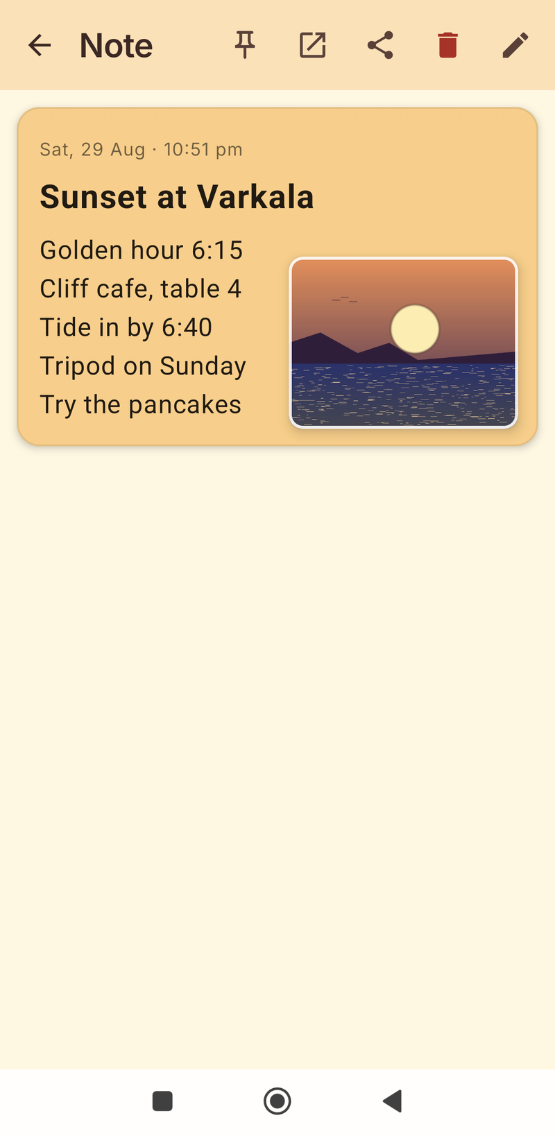 Orange note with a sunset photo placed beside four short lines of text